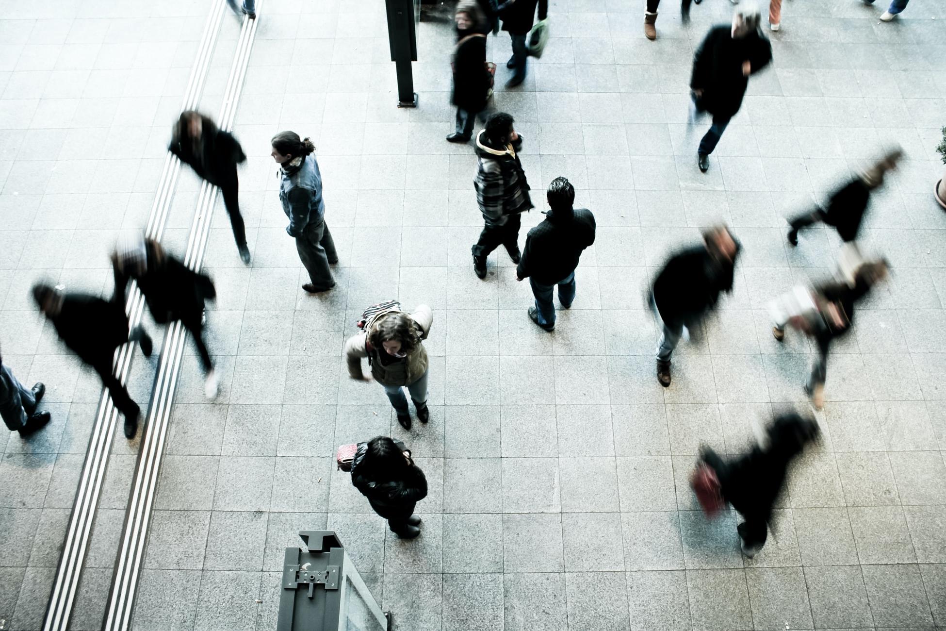 People walking around in a building.